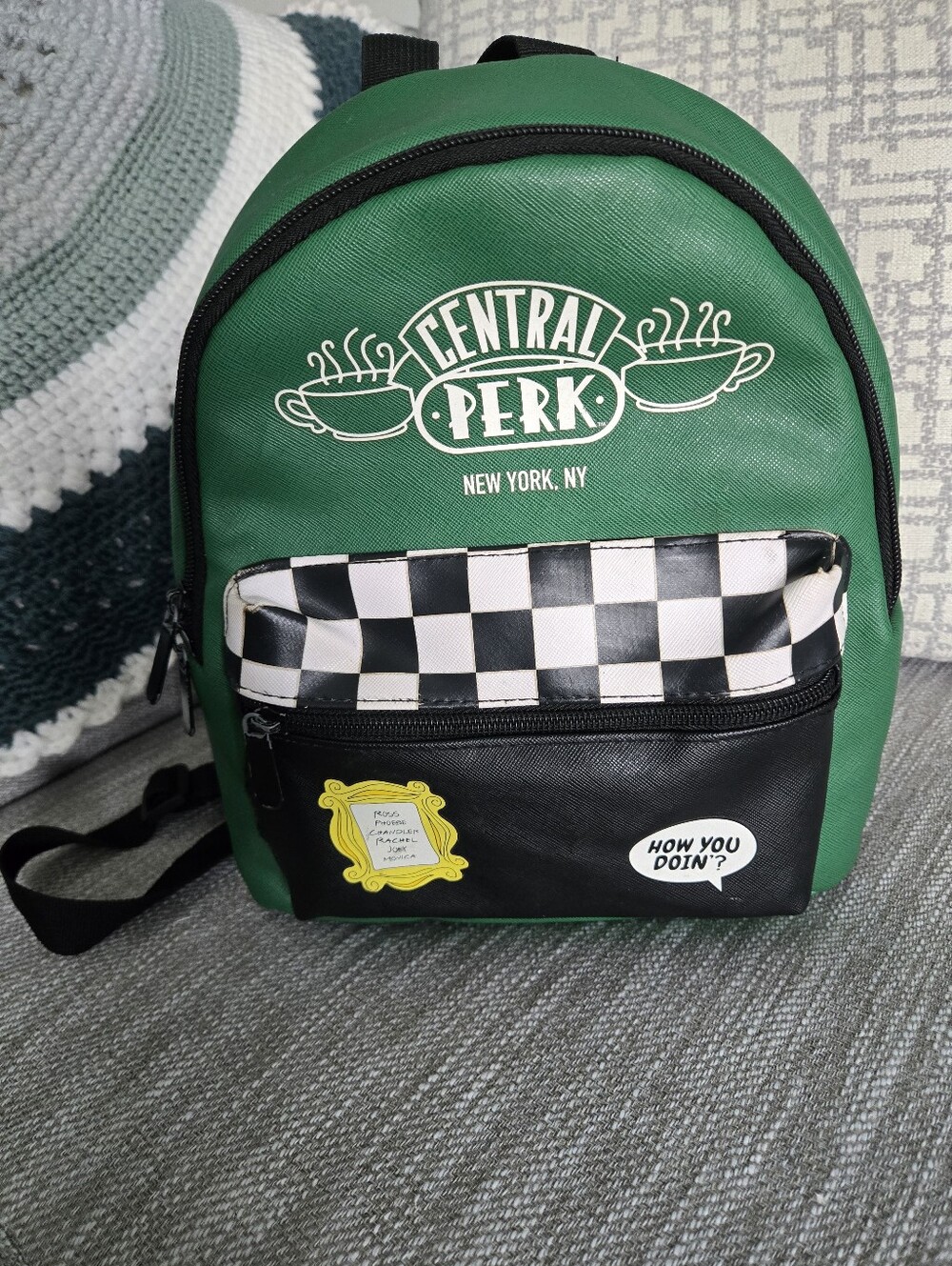 This green and black Friends Central Perk faux leather mini backpack